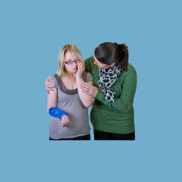 a support worker consoling an unhappy or worried person